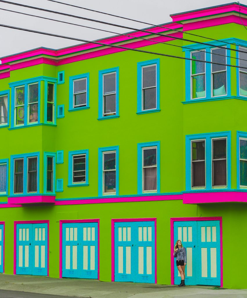 lime green house with blue and pink trims