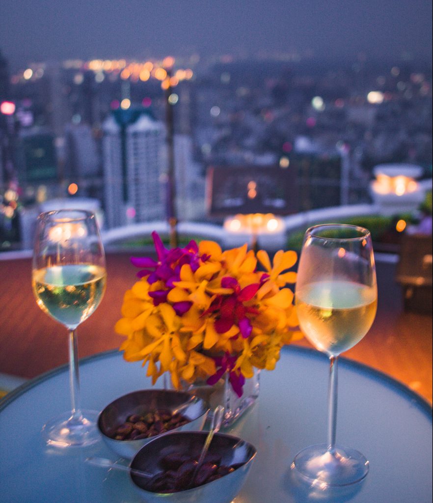 Wine glasses on a table at the rooftop Sky Bar