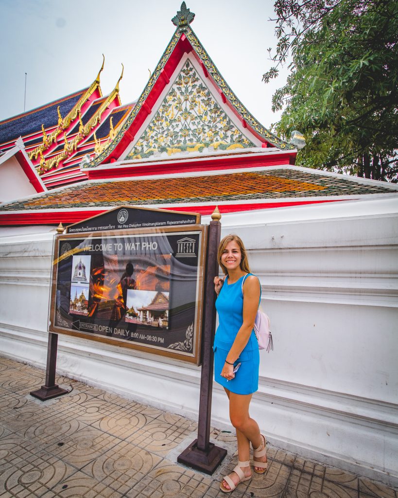 Me in front of the Wat Pho sign