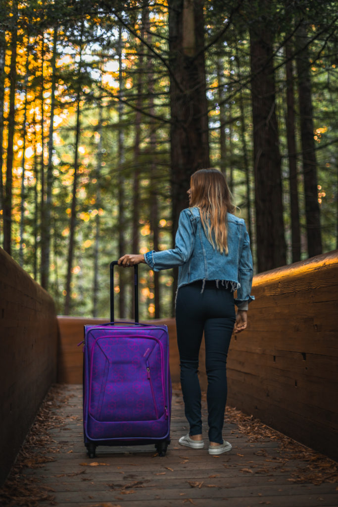 American Tourister purple luggage