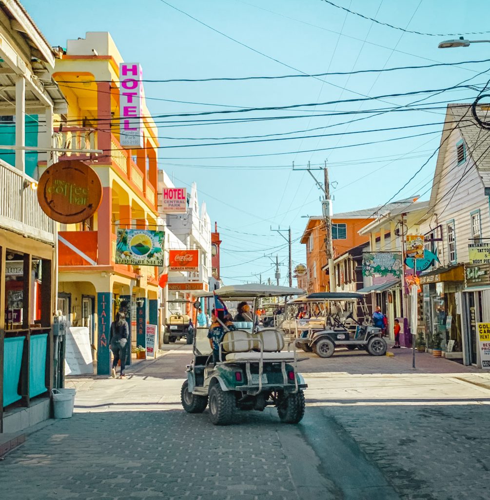 Front Street in San Pedro with a golf cart going down the cobblestoned roads