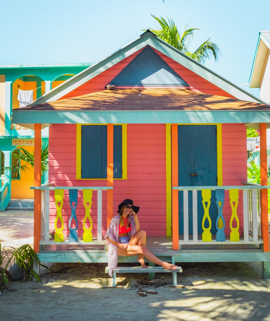 Me on a colorful home in Caye Caulker, Belize