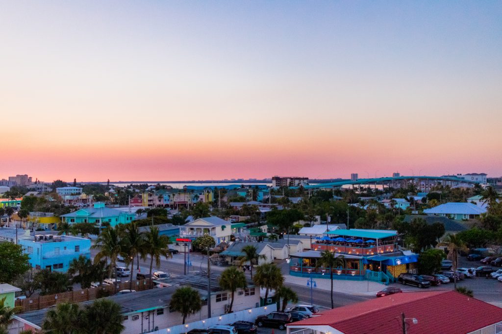 Sunset over Fort Myers Beach buildings