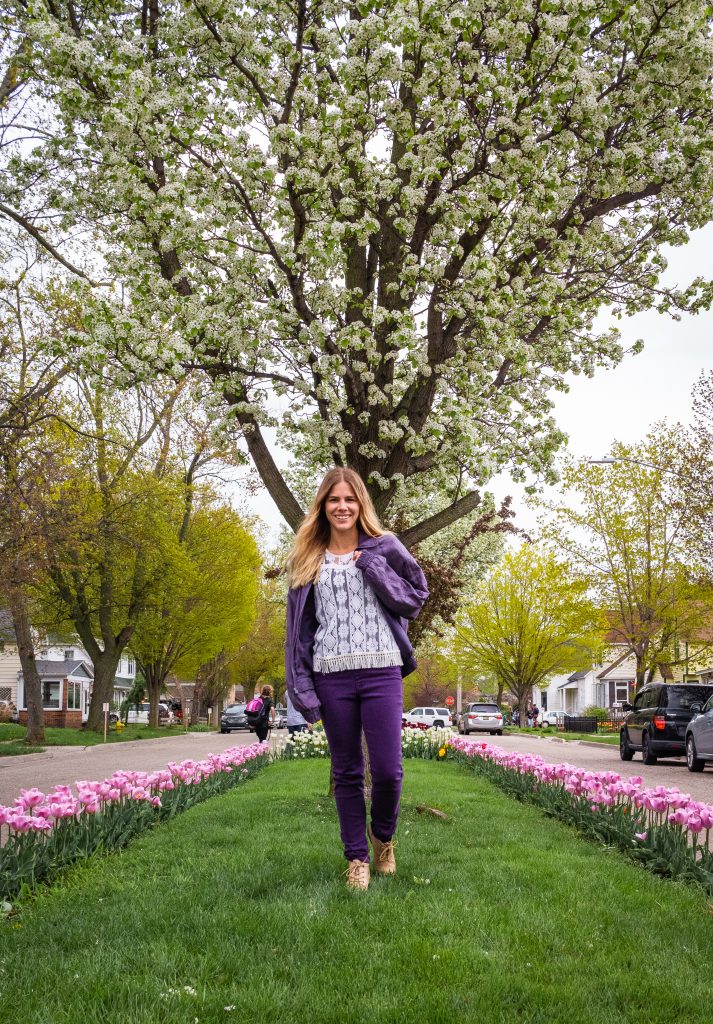 Me on the road between rows of pink tulips