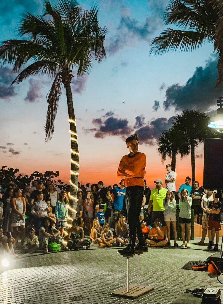 a performer at the square at sunset
