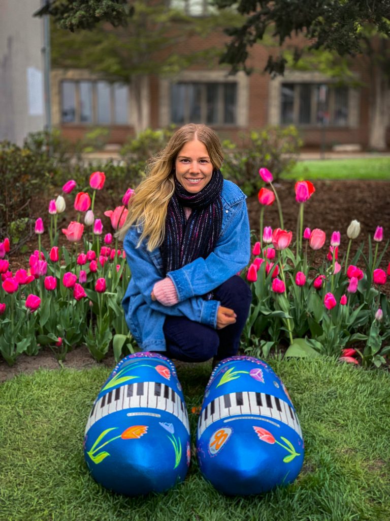 Me with the large wooden shoes decorated with tulips and piano keys