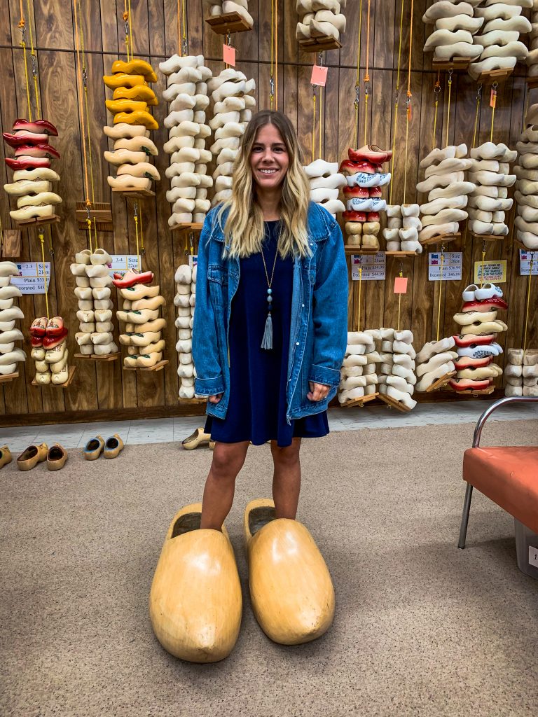 Me trying on a giant wooden shoe