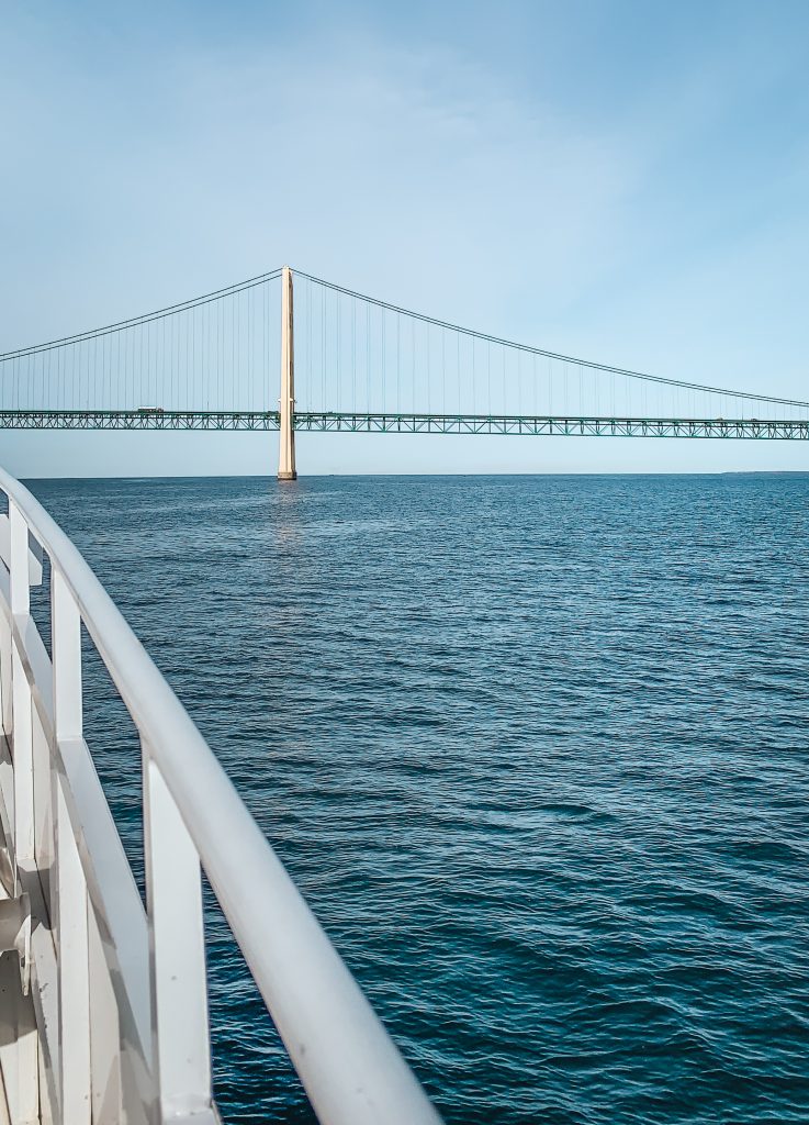 A view of the ferry approaching Mackinac Bridge from the water