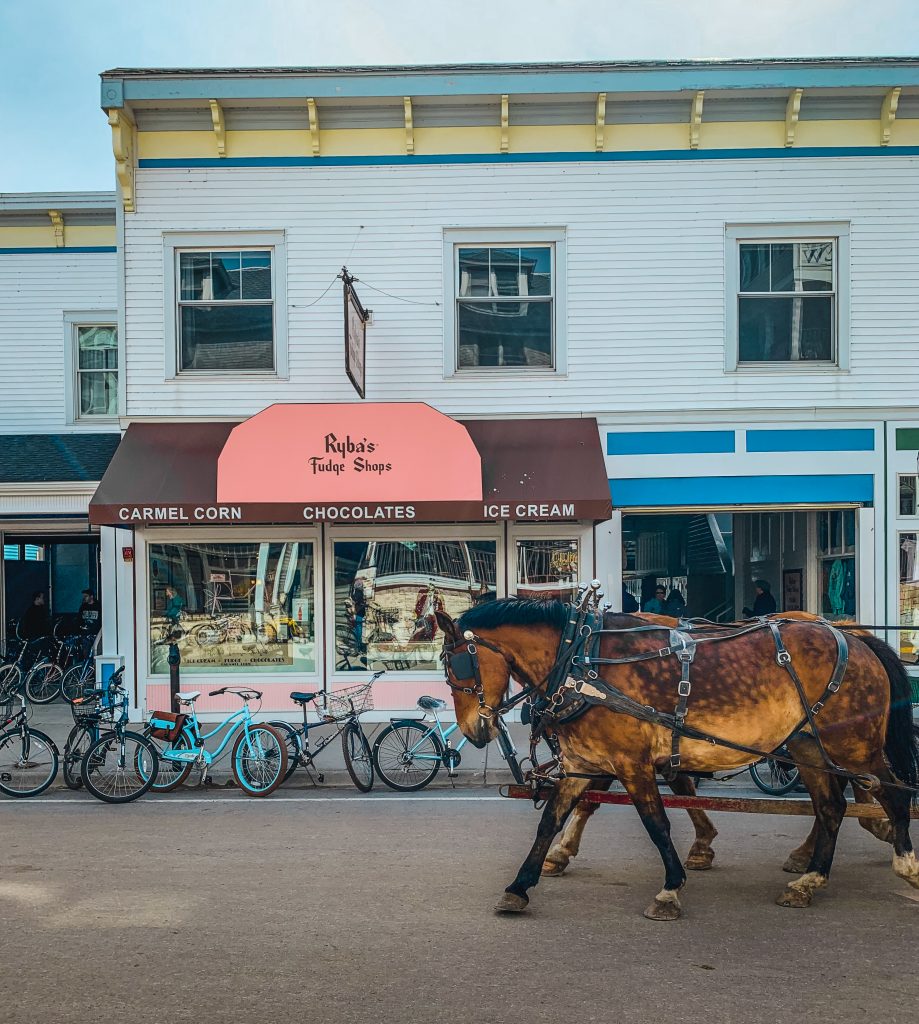 Fudge shop with horses trotting by