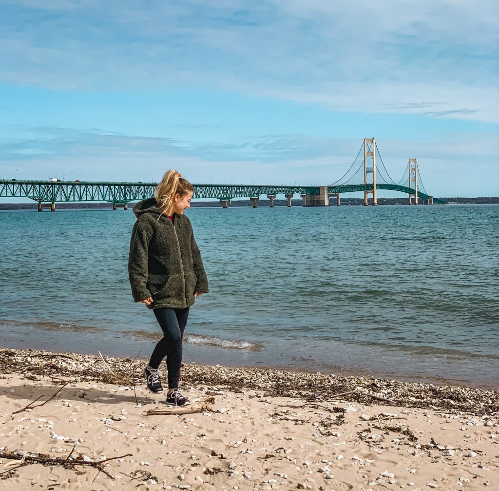 Me on the beach with the Mackinac Bridge in the background