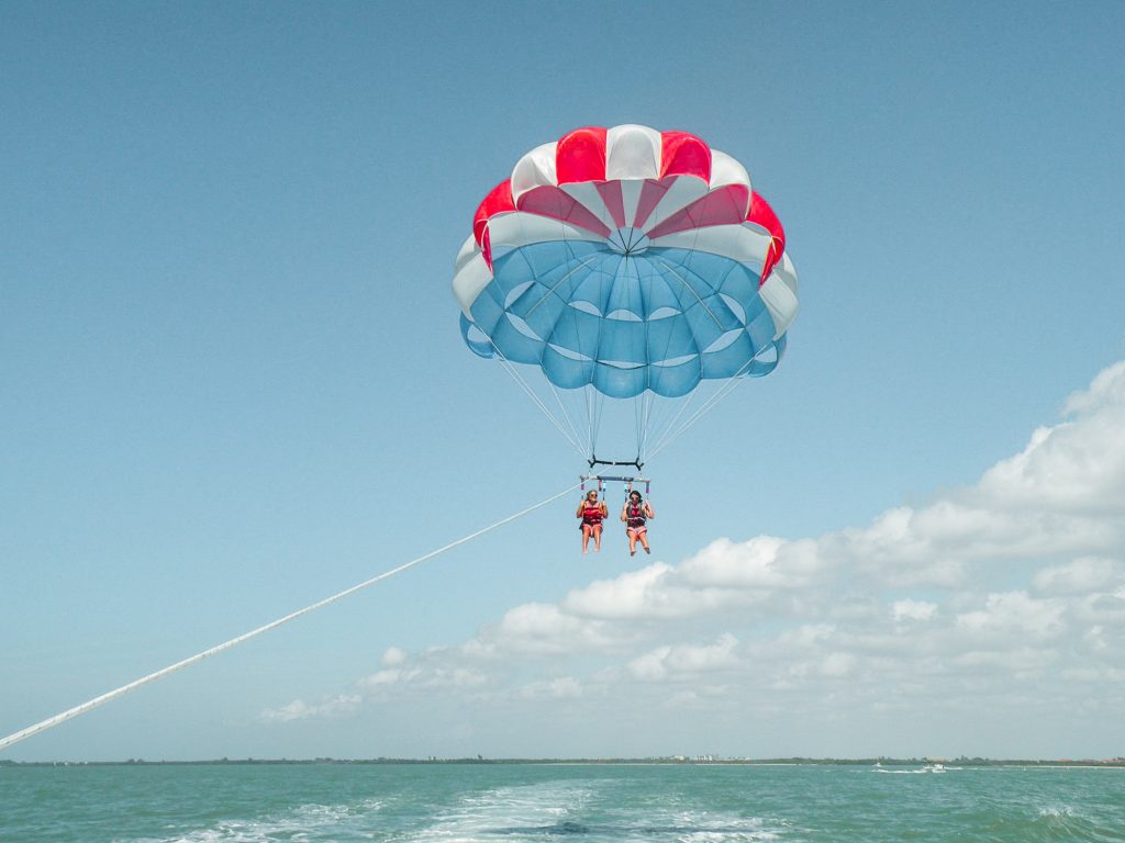 Me and a friend parasailing over the ocean